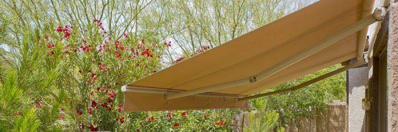 backyard with automatic retractable awning for extra shade