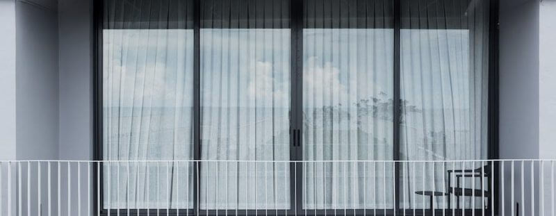 glass doors covered by curtains