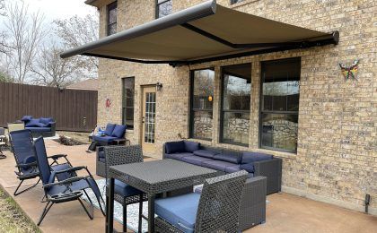 Home with a retractable awning in Texas