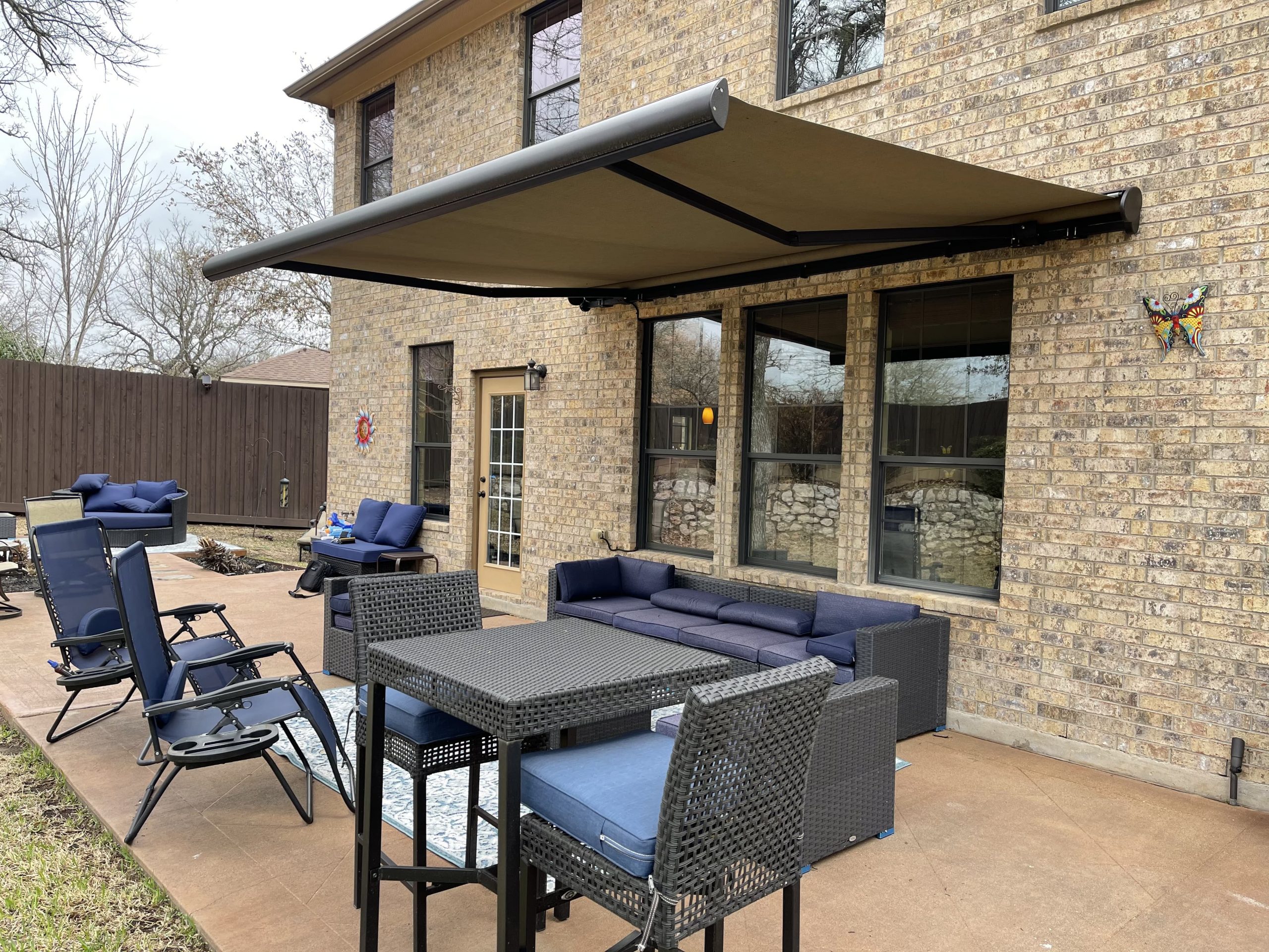 Home with a retractable awning in Texas