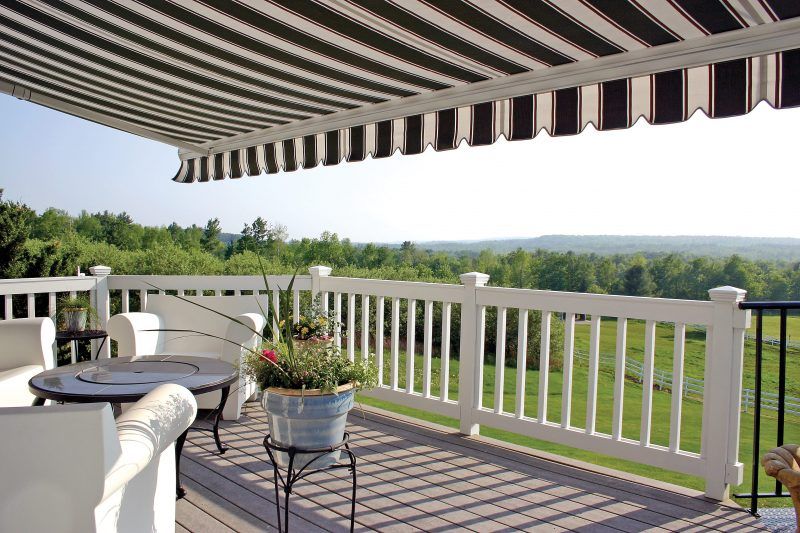 House with a striped deck awning