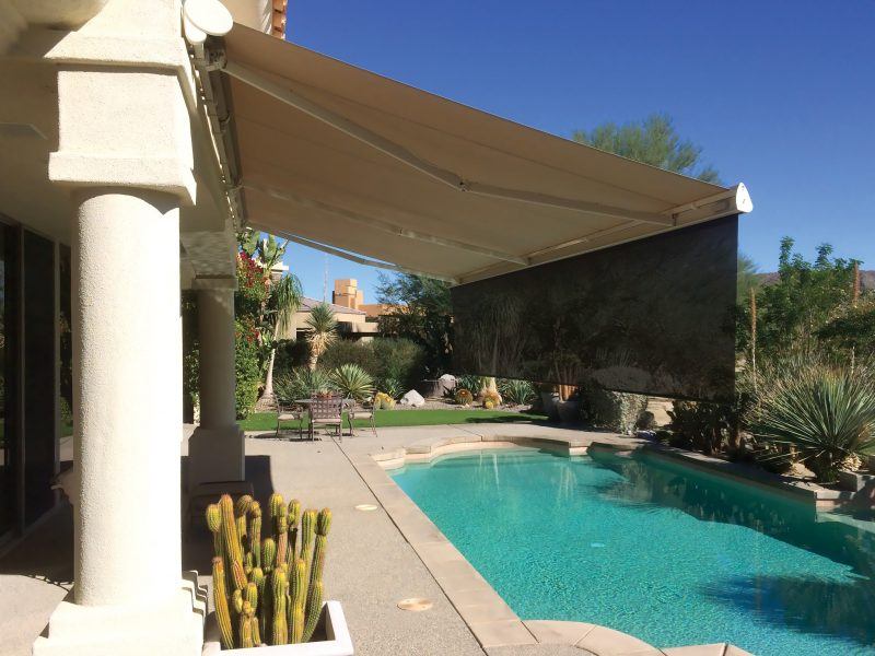 Home with a motorized awning and sun shade