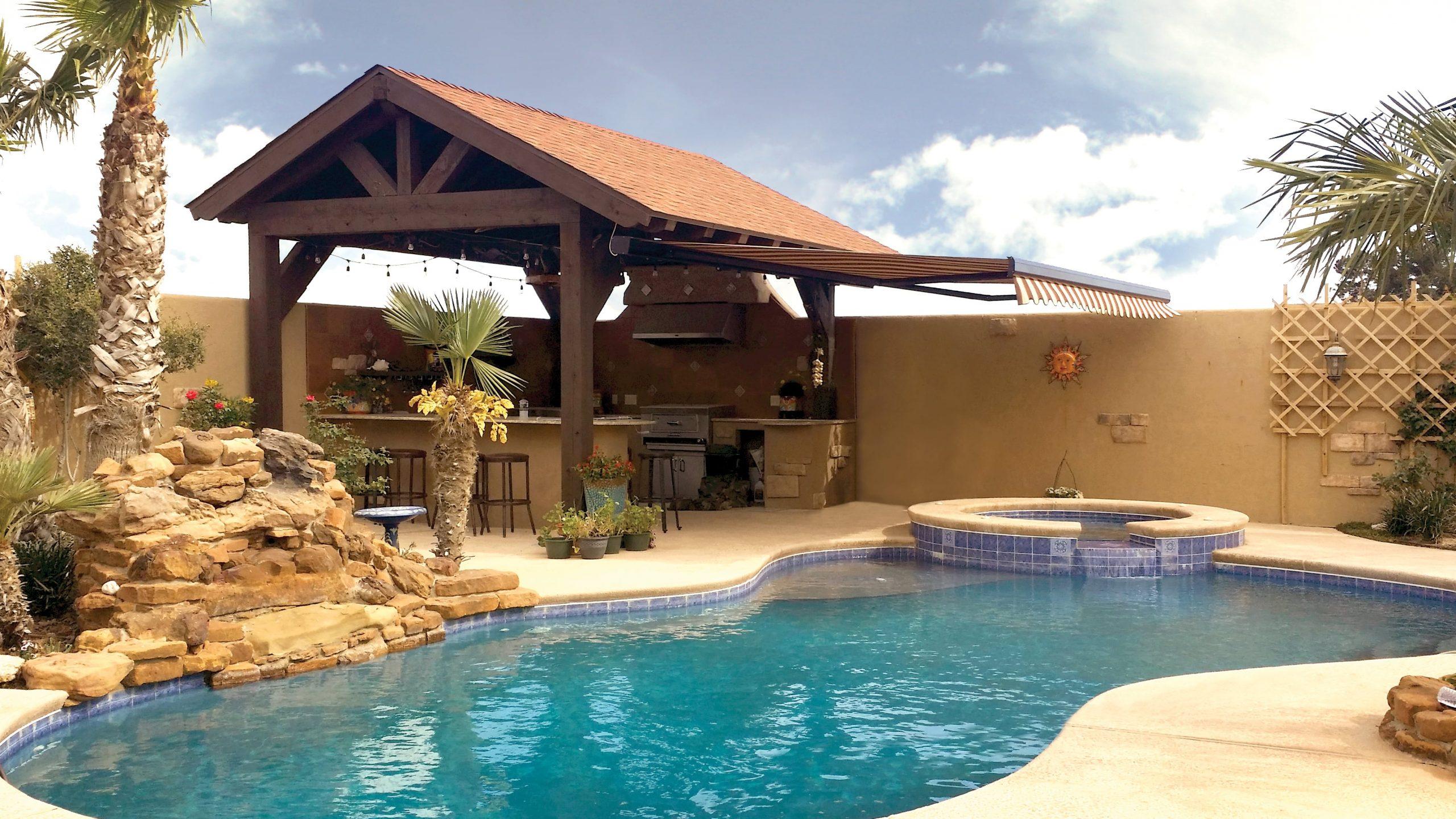 Pool cabana with a patio awning in Texas