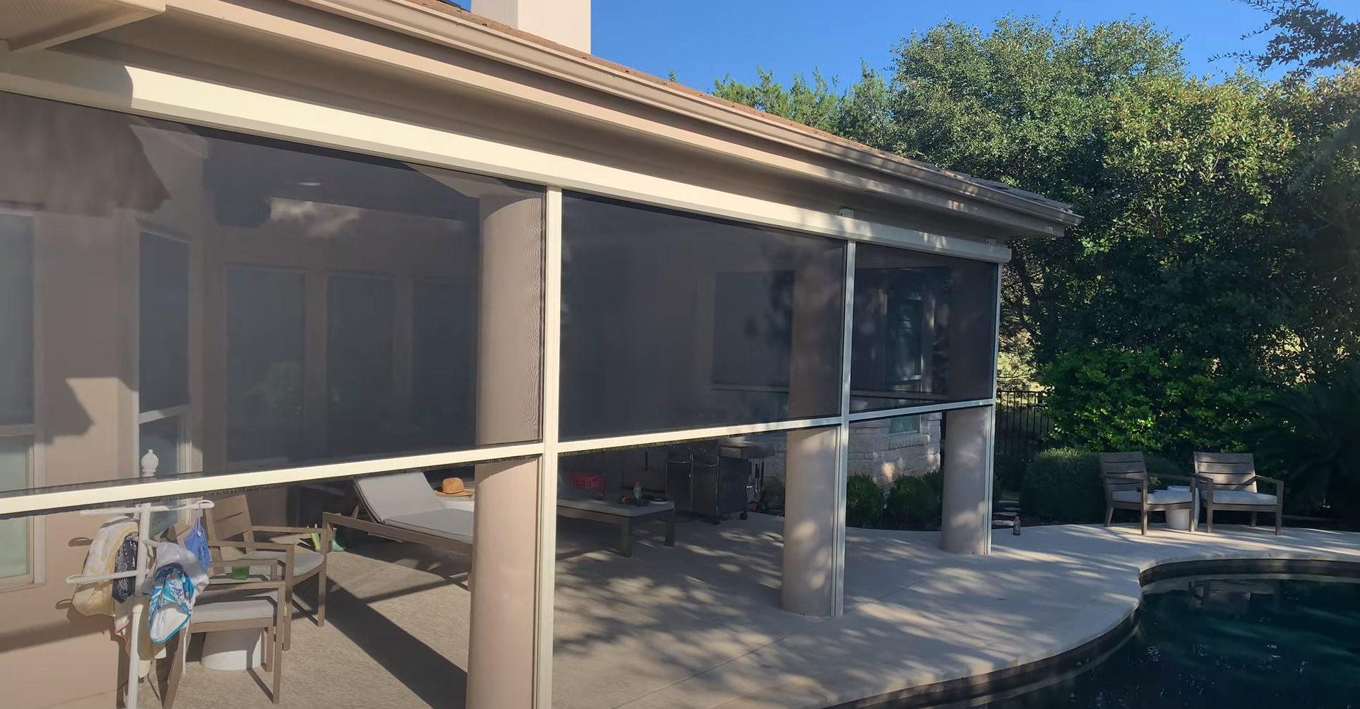 Home with sun shades by a pool in Texas