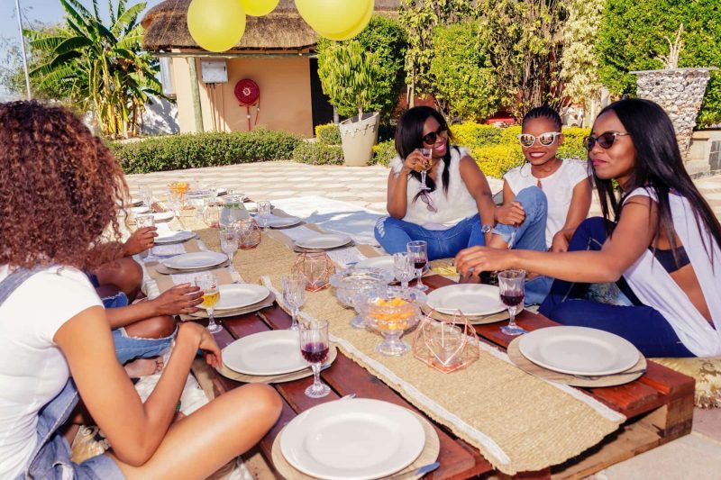 A group of women at an outdoor dinner party