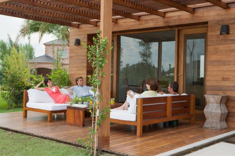 People relaxing on their back patio